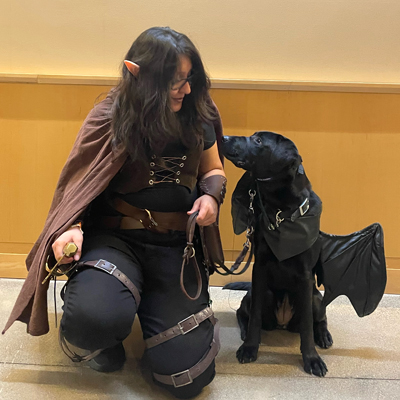 Erin and Lanza at each other, in Halloween costume